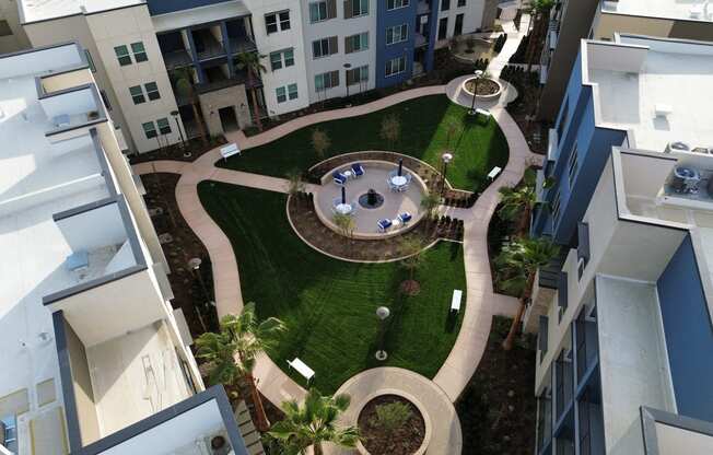 an aerial view of the courtyard of an apartment building with a lawn  at Westbury Apartments, Rancho Cucamonga, 91739