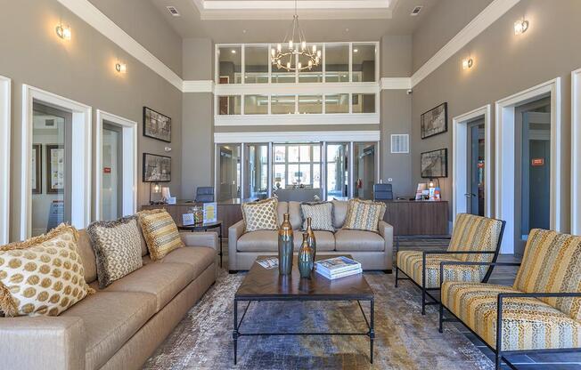 a living room filled with furniture and a large window