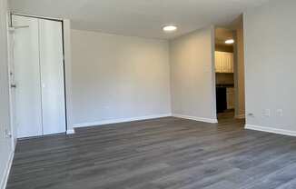 Renovated apartment with wood-like flooring at Barracks West apartments in Charlottesville, VA