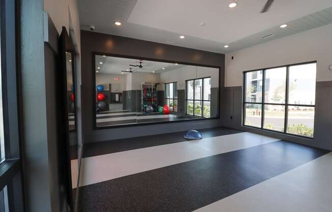 a workout room with a large window and a ball on the floor at The Crest at Acworth, Acworth, GA, 30102