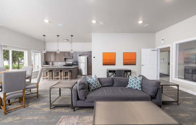 A modern living room with a grey couch and a wooden coffee table.
