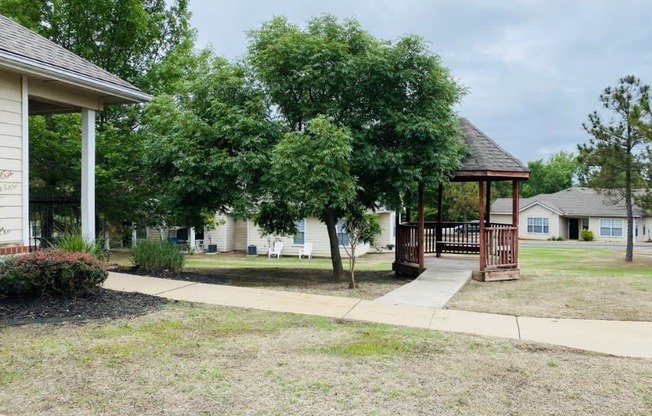 a gazebo in front of a white house at EDGEWOOD AT GABLES Apartments, Oklahoma, 74127