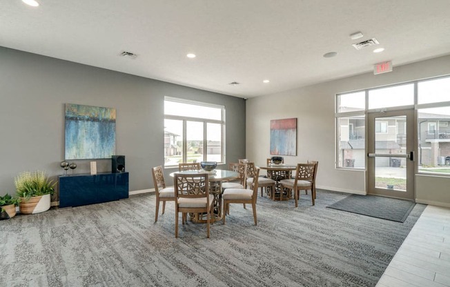 Resident social spaces with chairs and tables at The Villas at Falling Waters townhomes for rent in west Omaha