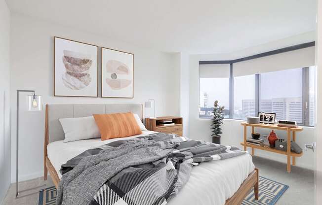 a bedroom with a bed and a large window