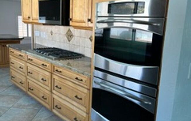 Spacious 4BR Home with Gated Pool, Chef’s Kitchen & 3-Car Garage