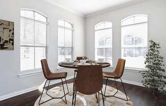 a dining room with big windows