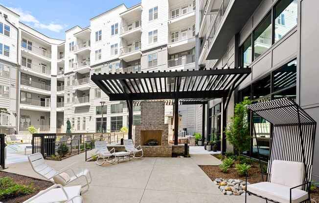 Alton Mill District Apartments in Charlotte, North Carolina Poolside Patio with Fireplace