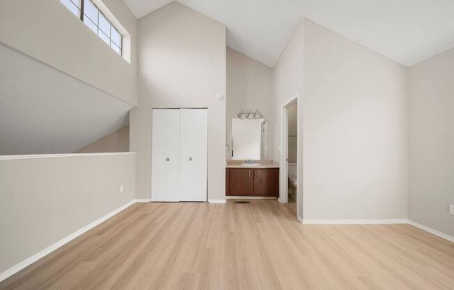 A room with a wooden floor and white walls.