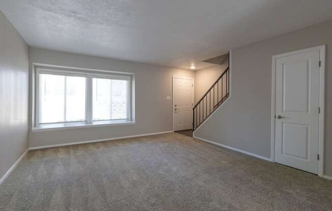 Spacious Living Room in the Two Bedroom Townhome at Woodbridge Apartments Bloomington