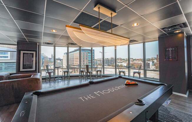 A pool table with the word "THE" written on it.