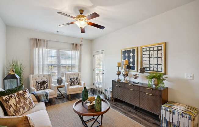 Living room with furniture and a ceiling fan  at The Meadows, Bloomingdale, GA