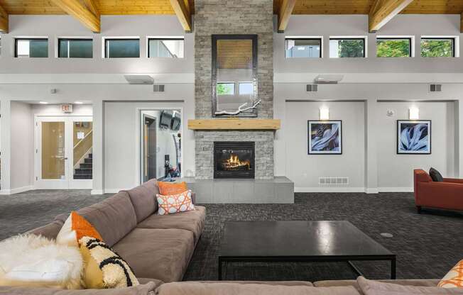 A living room with a fireplace and a couch.