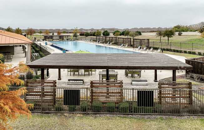 poolside outdoor pavilion with grills and al fresco dining at Villages 3Eighthy apartments