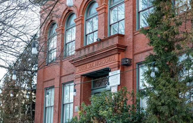 a large brick building with a sign in front of it at Residences at South High, Pittsburgh Pennsylvania ? 