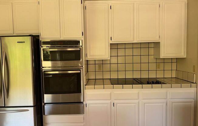 Lots of Square Footage in this wonderful 4 Bedroom (+ Bonus Room) 2.5 Bath Home...Beautiful Park Like Backyard.