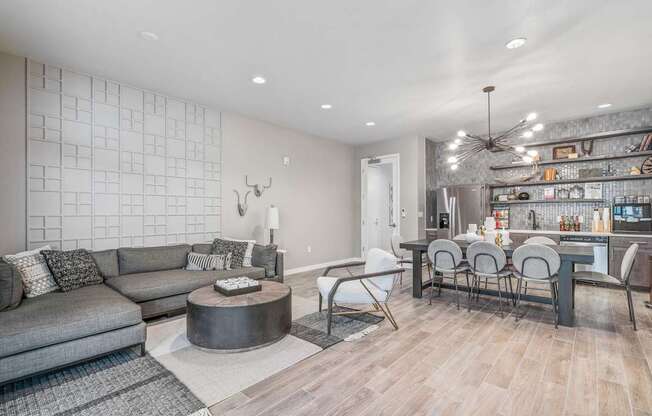 a living room with a couch and a table with chairs
