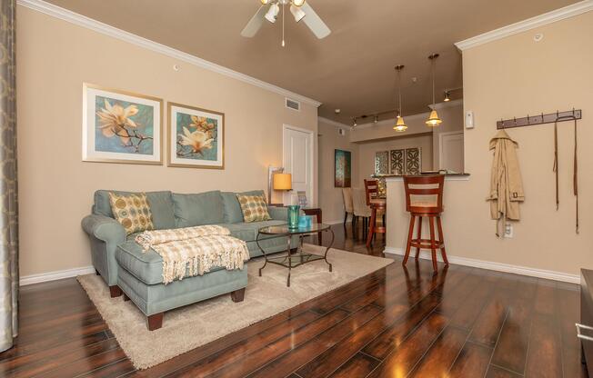 a living room filled with furniture and a flat screen tv