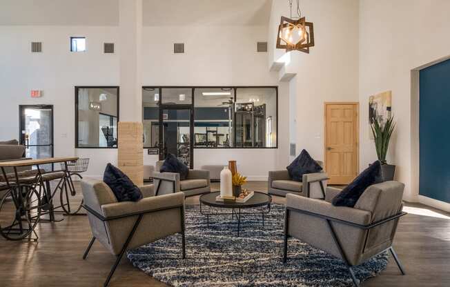 a living room with couches and chairs and a table