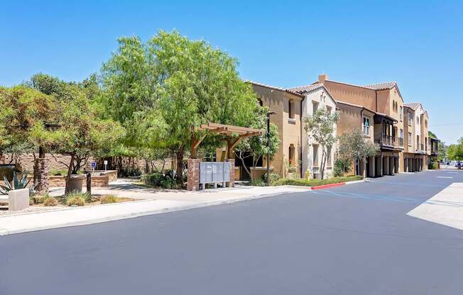 A street view of a residential area with houses and trees.