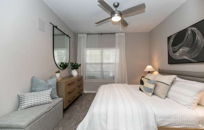 create a relaxing bedroom with a large bed and a ceiling fan at Willowest in Lindbergh, Atlanta