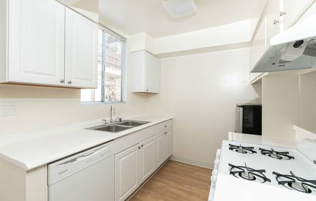 Kitchen with White Appliances and White Cabinets