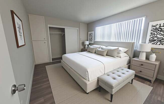 A bedroom with a large bed, a bench, and a dresser.