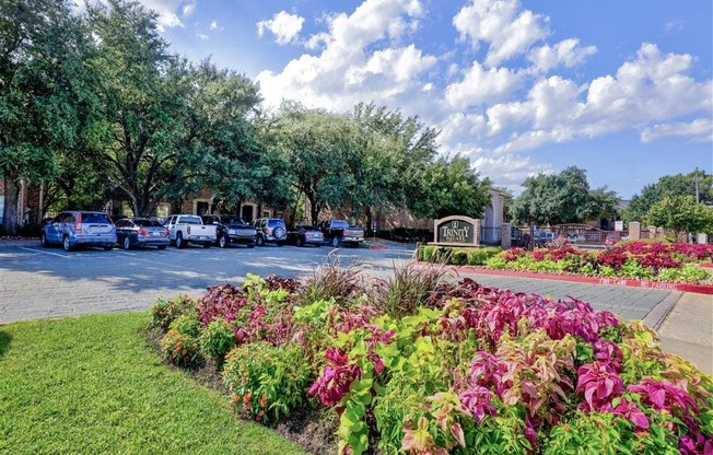 Gated entry to Trinity Square Apartments in North Dallas, TX, For Rent. Now leasing 1 and 2 bedroom apartments.