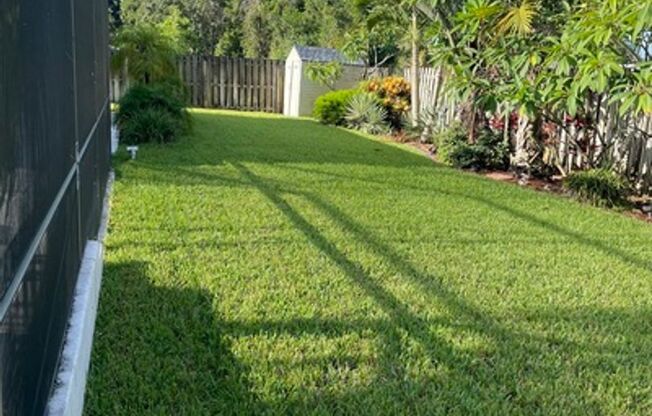 Well maintained large 4/2/2 corner lot pool home on a canal