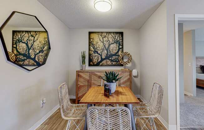 a dining room with a table and chairs