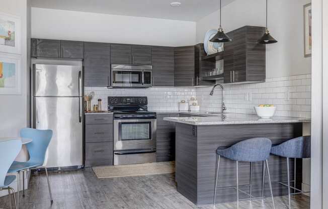 a kitchen with stainless steel appliances and a counter