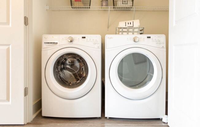 Arabelle Perimeter Luxury Apartments in Atlanta, GA 30328 photo of a white washer and dryer next to each other in a laundry room