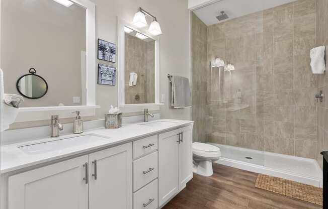 a bathroom with a sink and a shower and a toilet at Hayden Lofts, Dublin, Ohio
