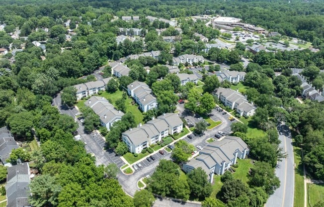 A bird's eye view of a residential area with houses and trees.