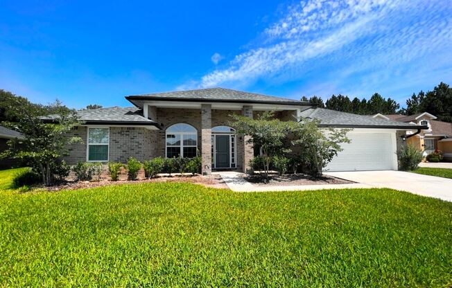 Like New 4/2 fully brick home with huge yard