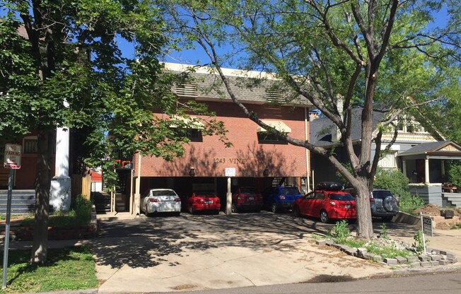 CHEESMAN PARK! TWO STORY CONDO! ADDITIONAL HALF BATH ON MAIN LEVEL! PARKING, HARDWOODS, STORAGE!