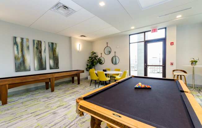 a game room with a pool table and a ping pong