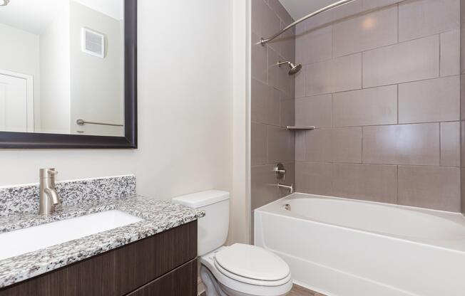 a room with a sink and a mirror