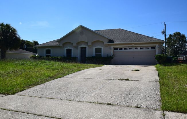 This charming 4 Bedroom, 2 Bath Single Family Home For Rent at 3785 Trade St. Deltona, FL 32738