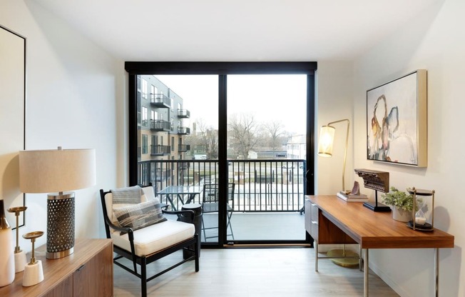 View of Balcony with glass door leading to a cityscape at The Hill Apartments, Saint Paul