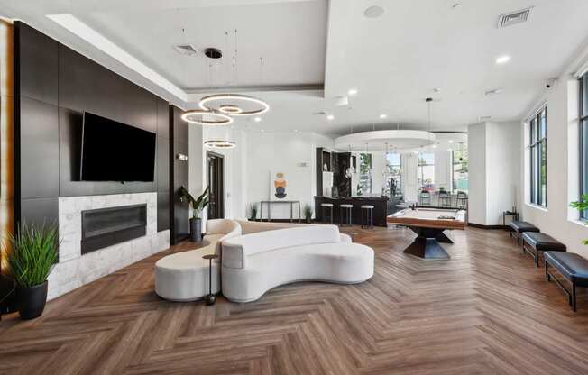 A modern living room with a fireplace and a white sofa.