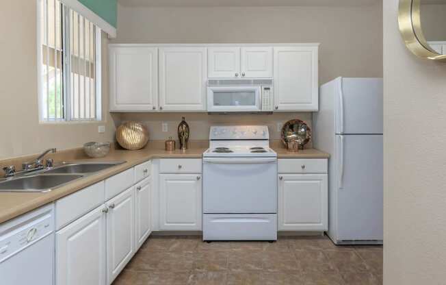 Kitchen area with cabinets at The Covington by Picerne, Nevada, 89139