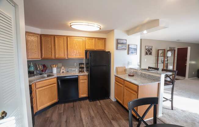 Kitchen with oven, dishwasher, refrigerator, and pantry at Archers Pointe.