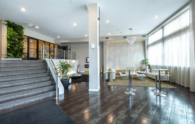 a lobby with a reception area and a staircase