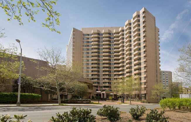 an apartment building with a street in front of it