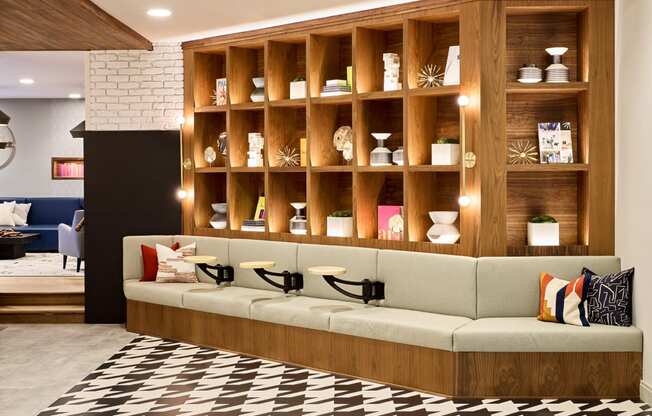 a living room with a couch in front of a wall with shelves at Dey & Bergen, New Jersey