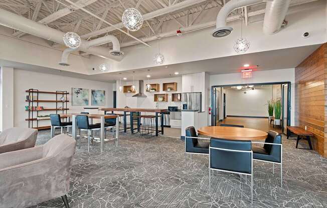 A modern office space with a patterned carpet and a variety of seating options.