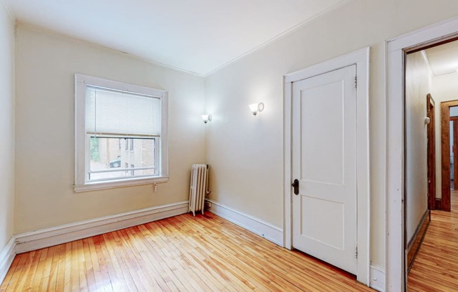 Sibley_3br_bedroom 1 with closet and hardwood floors