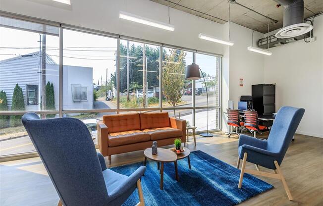 a living room filled with furniture and a large window at Jefferson Yards, Washington