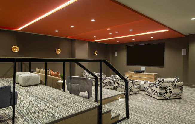 Step into the world of cinema at Modera Garden Oaks' theater room, featuring a large projection screen for captivating movie nights and entertainment.