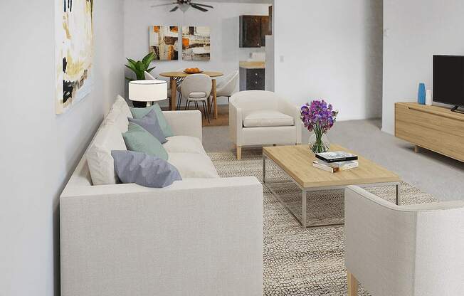 A living room with a couch, chairs, and a coffee table.